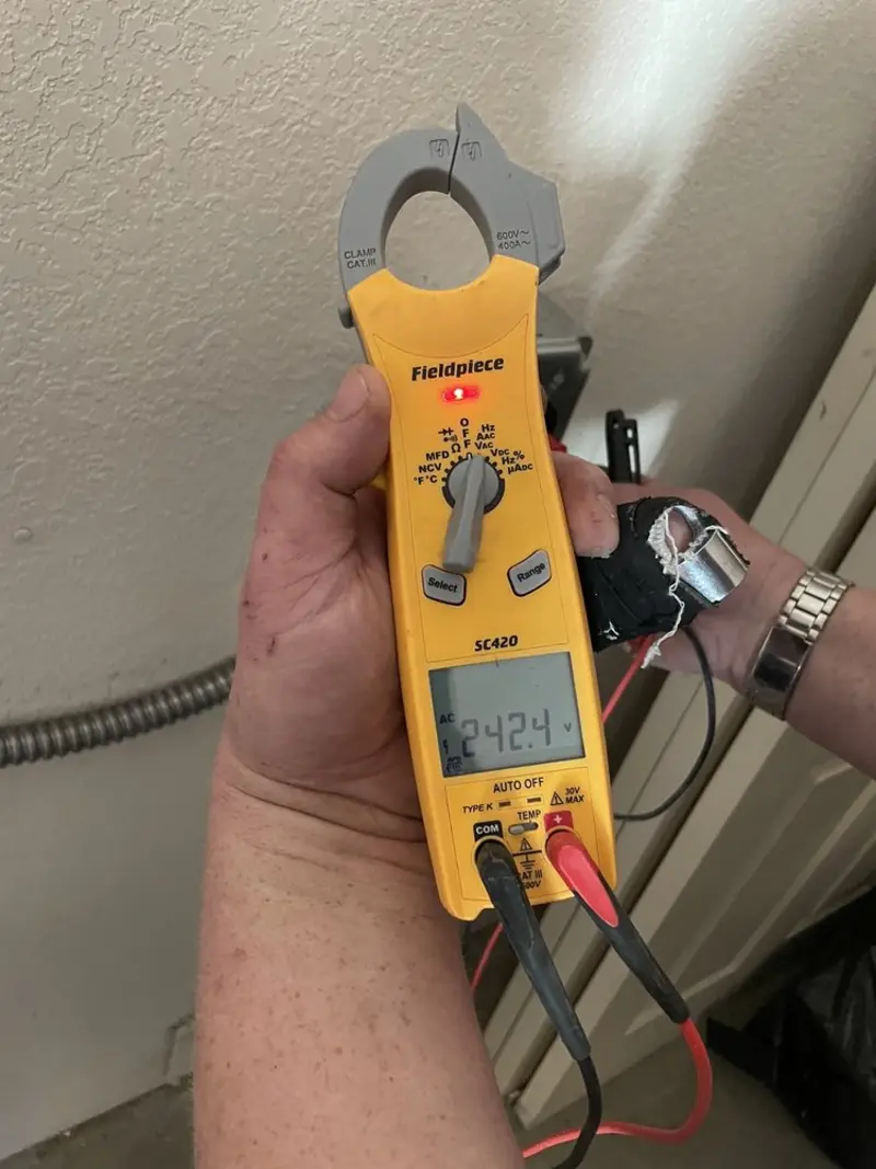 Voltage testing with clamp meter during Ceiling Fan Installation in Marine City